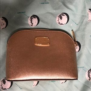 Gold Michael Kors makeup bag